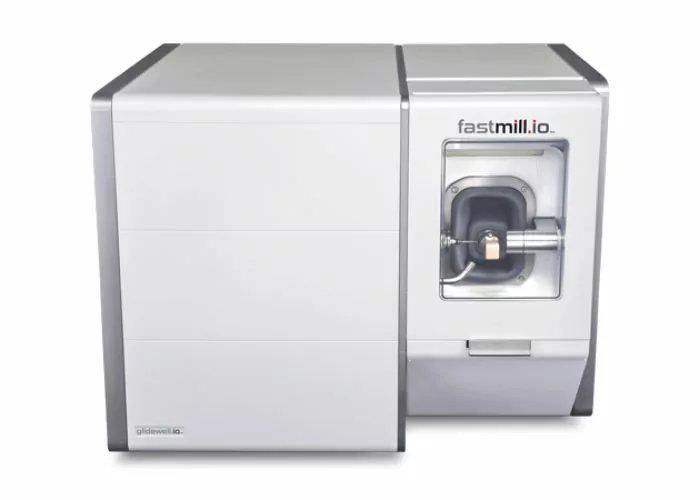Photo of a Glidewell Fastmill IO milling machine. A dental appliance that can mill dental crowns in a single day.