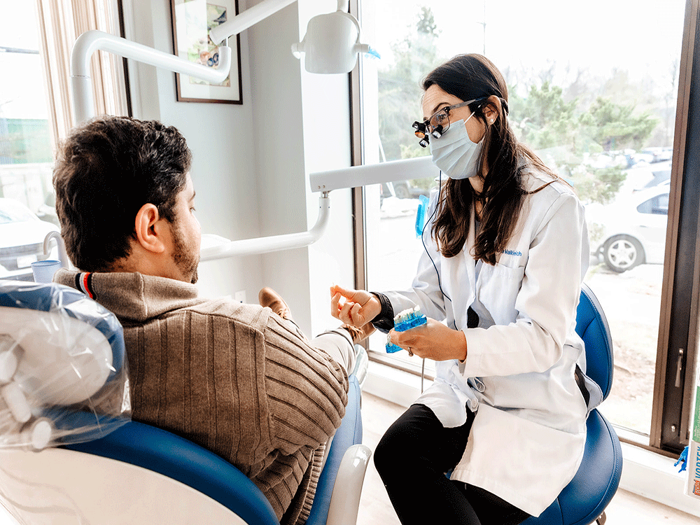 Dentist explaining treatment options to patient