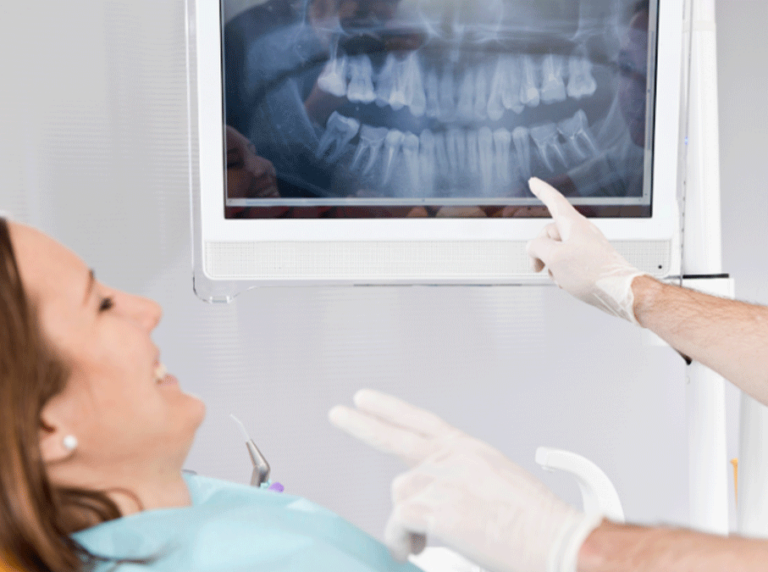 Patient viewing a digital X-ray of her teeth